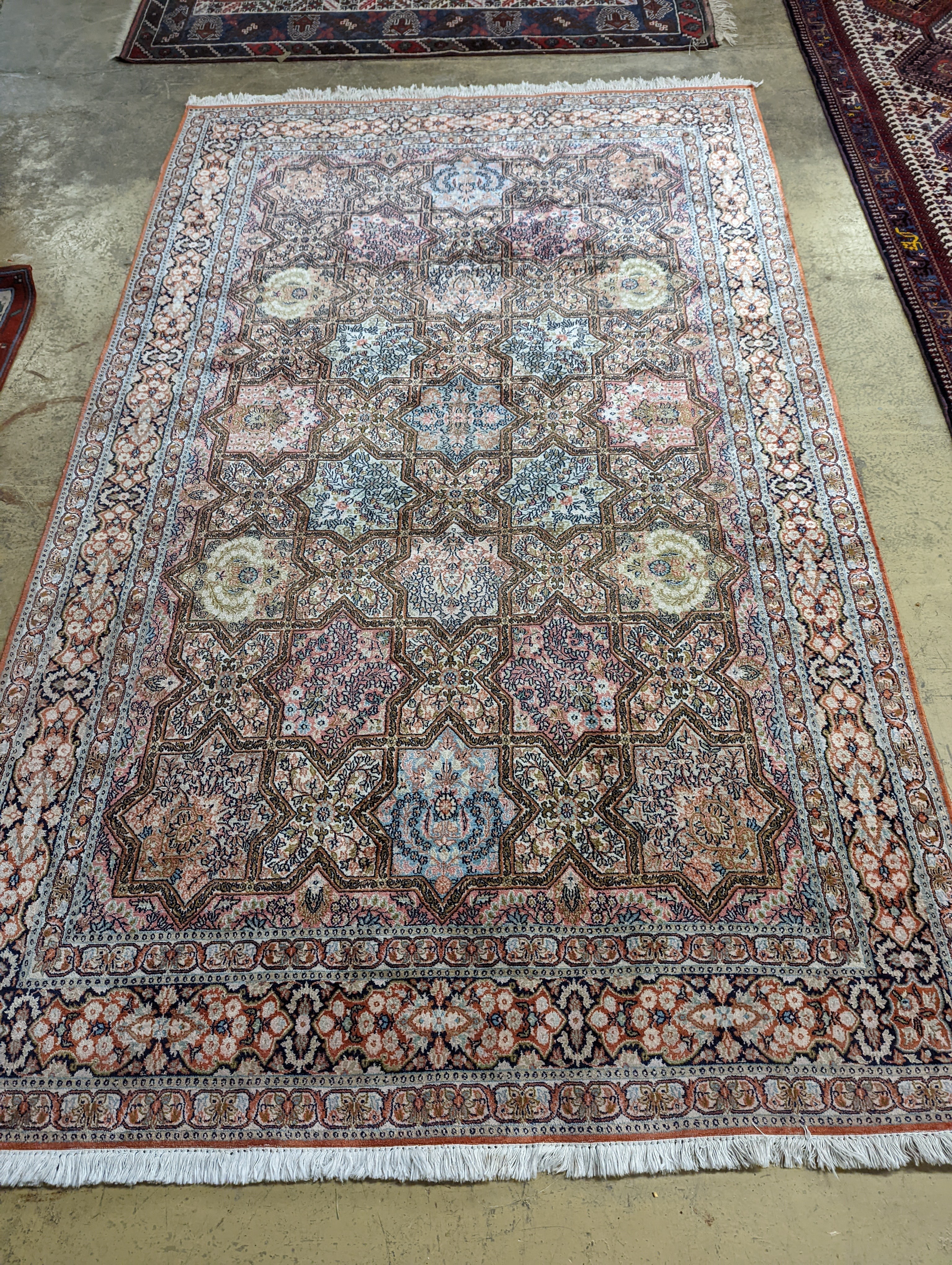 Two Turkish rugs and a Persian rugs. Largest, 284x172cm.